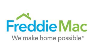 Couple holding keys to their new home after qualifying for a Home Possible mortgage